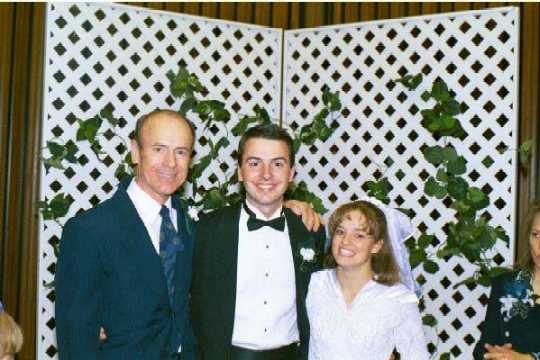 Dad, David, and Melanie at 2nd reception, May 1, 1999