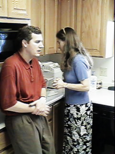 Larry and Jeannette in kitchen of home at 2002 Rosemary Ct., Thanksgiving, 1998